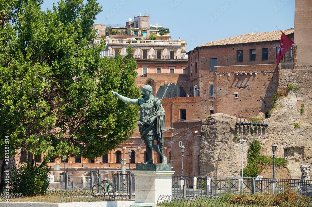 photo of Statua di Augusto near Forum of Augustus, view from from Via dei Fori Imperiali street, Italy