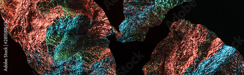 top view of glossy crumpled foil with colorful lighting reflection in darkness isolated on black