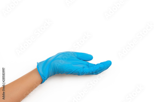 hand in a blue rubber glove holding something on white background