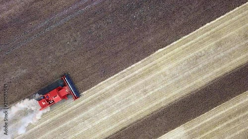 top view aerial of a harvester cropping a field