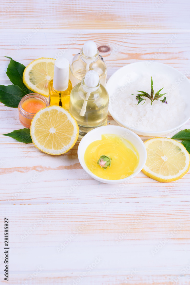 Beautiful layout of cosmetic oils on a wooden background. Natural cosmetics for face and body