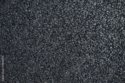 A new dark grey asphalt pavement texture.