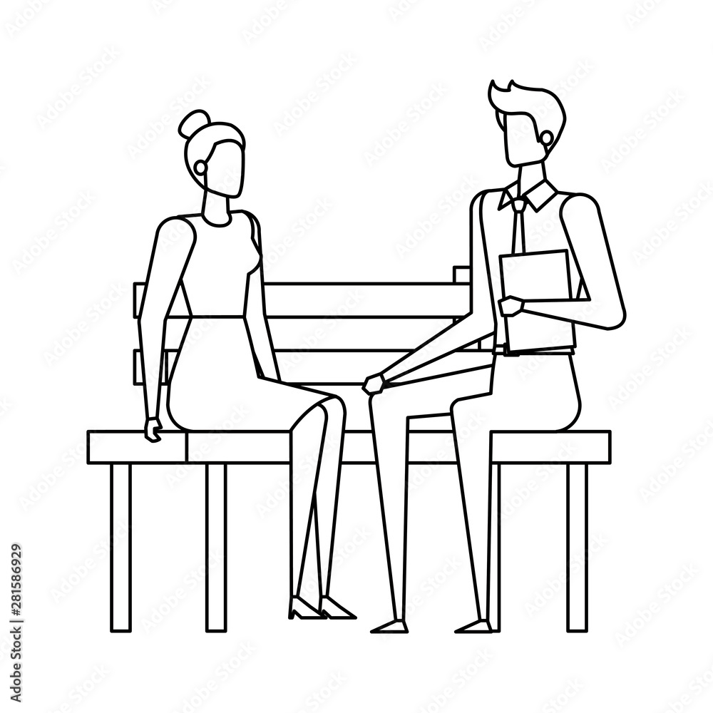 elegant business couple seated in the park chair