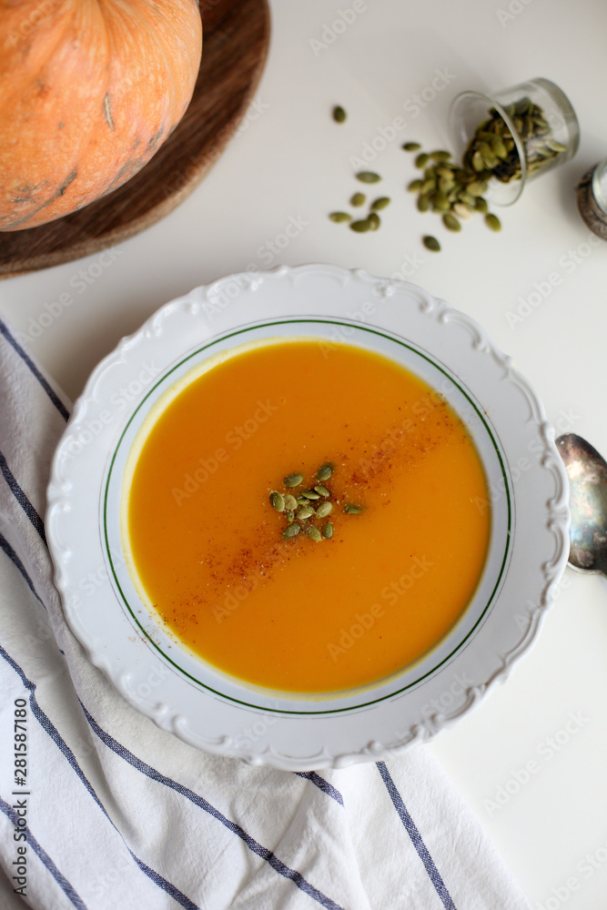 pumpkin soup puree on light background pumpkin soup puree on light background
