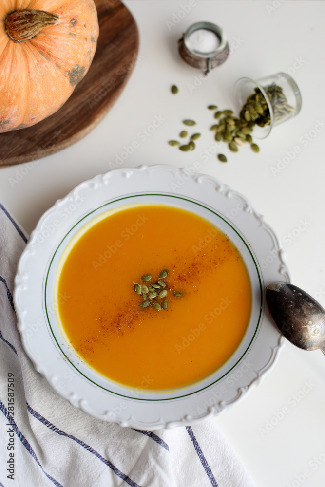 pumpkin soup puree on light background pumpkin soup puree on light background