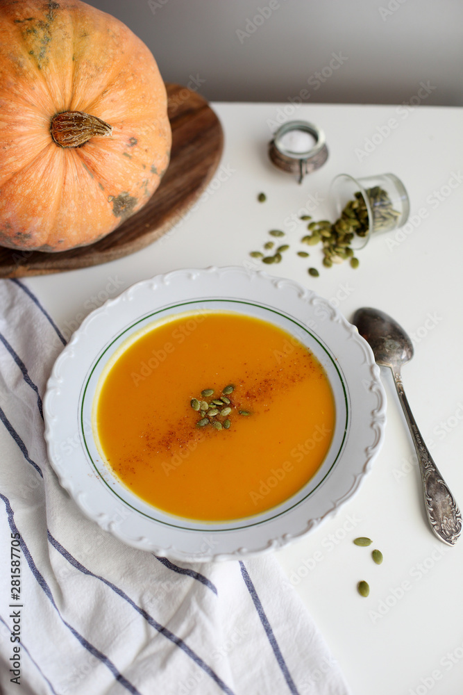 pumpkin soup puree on light background pumpkin soup puree on light background