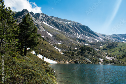 Mountain lake Estany de les Truites in Andorra Pyrenees, La Massana, refugi de coma pedrosa