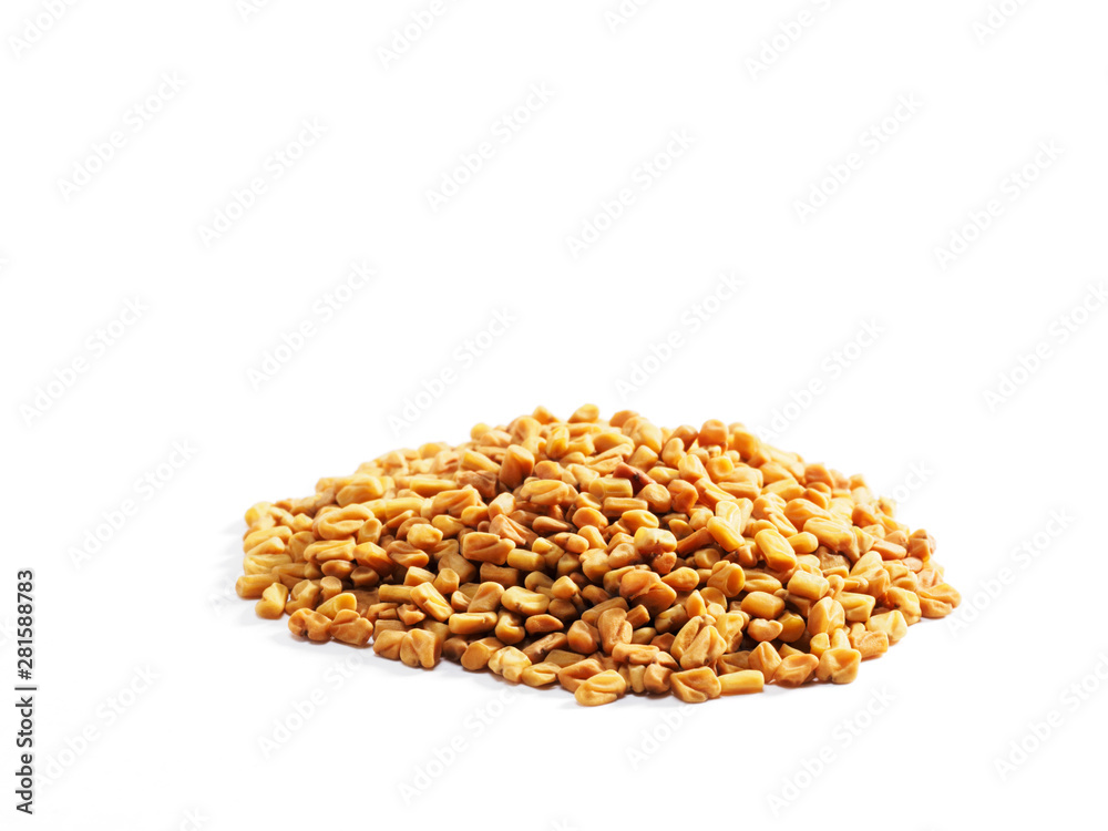 A bunch of fenugreek (Trigonella) on a white background macro A bunch of fenugreek (Trigonella) on a white background macro