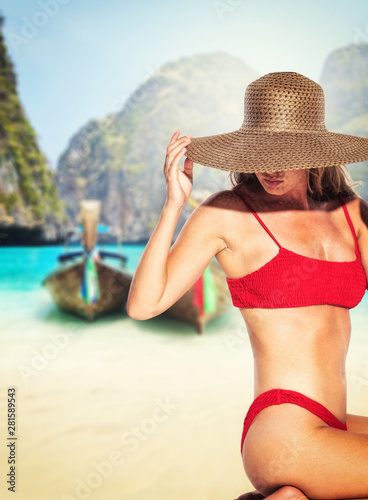 Brunette tanned girl in swimwear enjoying the beach