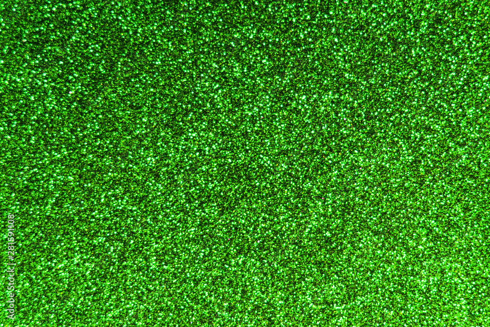Fototapeta premium Texture of green colored foamiran sheet with sparkles