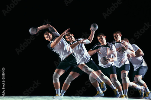 Caucasian young handball player in action and motion in mixed and strobe light on black studio background. Fit professional sportsman. Concept of sport, movement, energy, dynamic, healthy lifestyle. © master1305