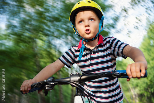 Low Angle View Of Boy Riding Bicycle