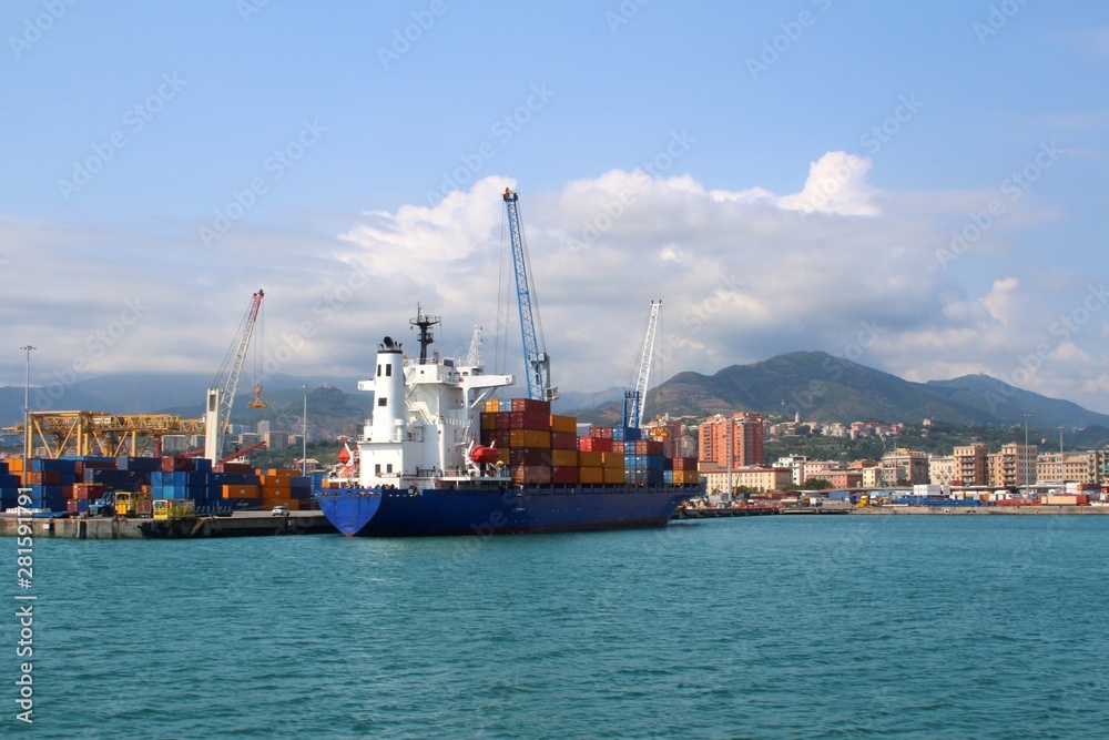 Seaside view on  the cityscape with industrial port, Genoa (Italy)