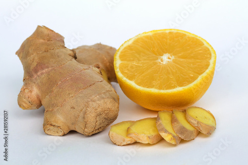 Fresh ginger and yellow lemon on a white background