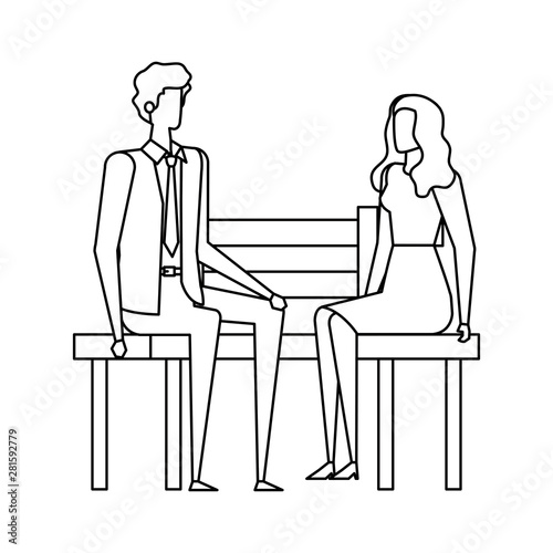 elegant business couple seated in the park chair