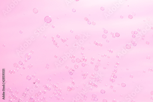 soap bubbles on a pink background