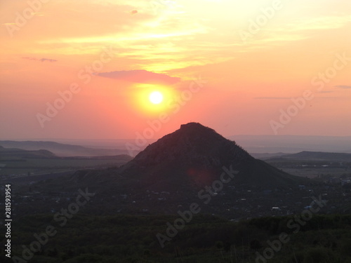 beautiful pink sunset by the mountain and valley