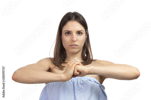 Tableau sur toile Portrait of a strong, determined girl on a white background