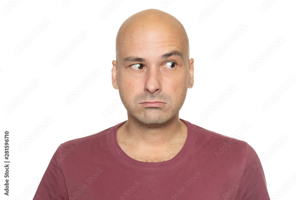 Bald 40 years man is looking aside. Isolated on white Bald 40 years man is looking aside. Isolated on white