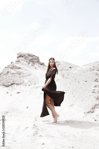 woman in long black dress dancing alone outdoor © Iveta