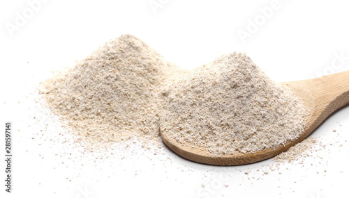 Barley flour pile with wooden spoon isolated on white background