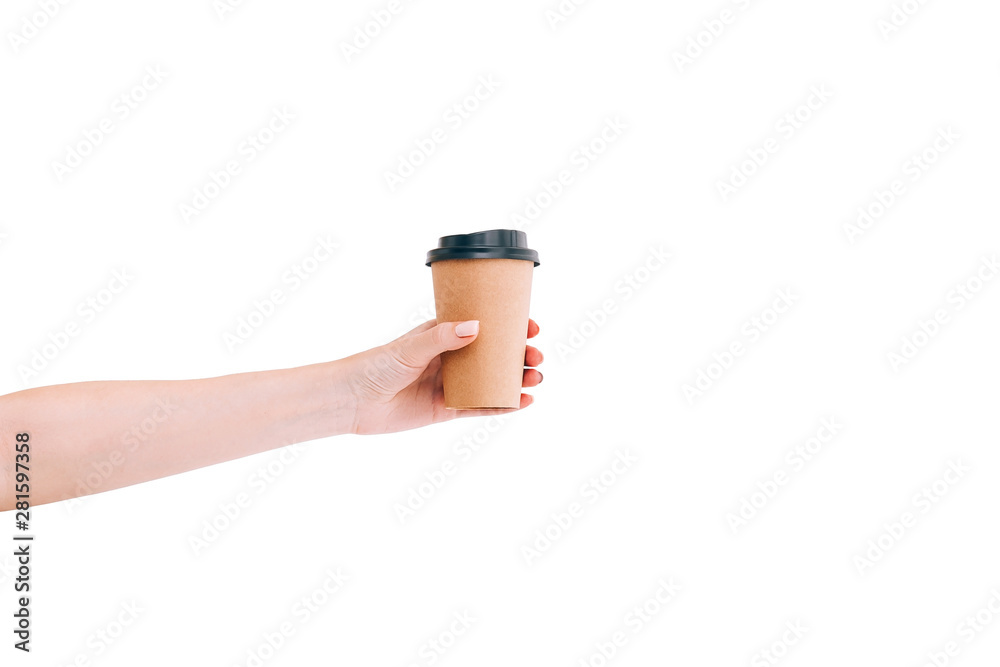 Paper coffee cup to go in woman's hand isolated on white. Mockup.