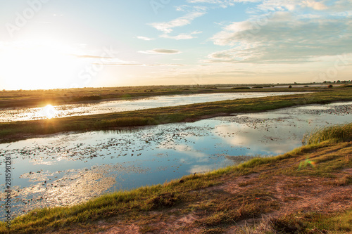 Beautiful sunset over wetlands in Thailand.