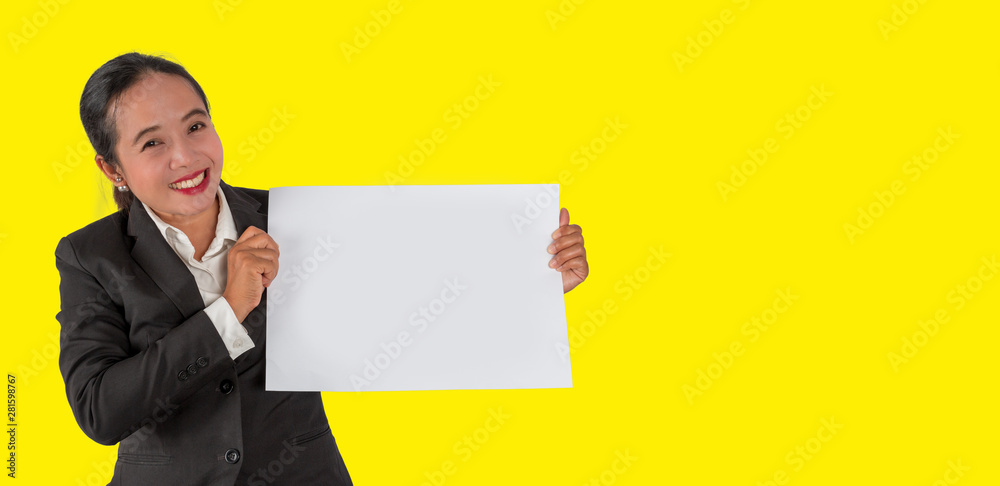 Business person holding a blank white paper in hand isolated on yellow background. Business person holding a blank white paper in hand isolated on yellow background.