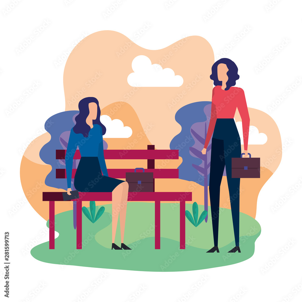 elegant businesswomen seated in the park chair