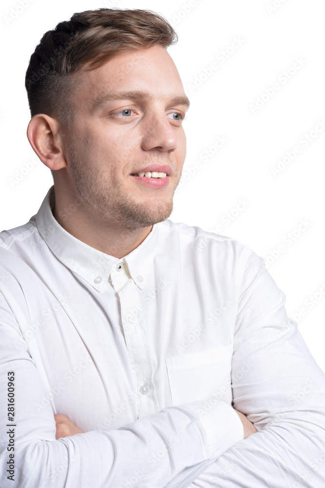 Portrait of handsome smiling young man wearing white shirt Portrait of handsome smiling young man wearing white shirt