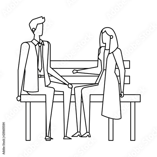 elegant business couple seated in the park chair