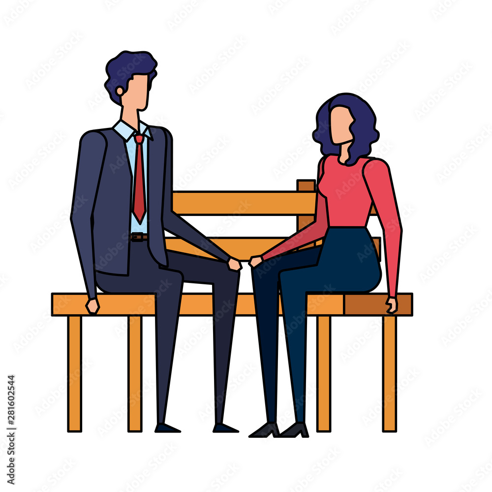 elegant business couple seated in the park chair