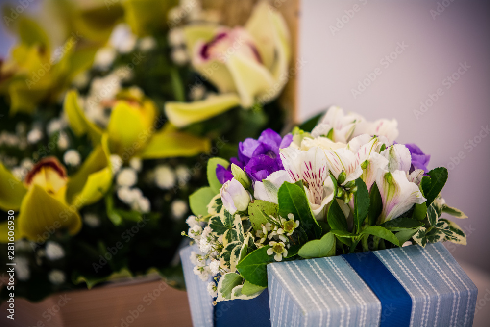 Colorful flower bouquets on desk as a gift