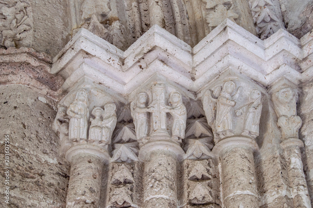 Romanesque capitals with carved figures of angels and saints