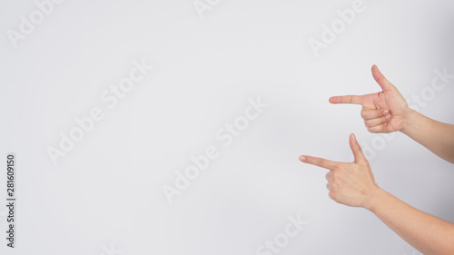 Male model is point the finger hand sign on white background.