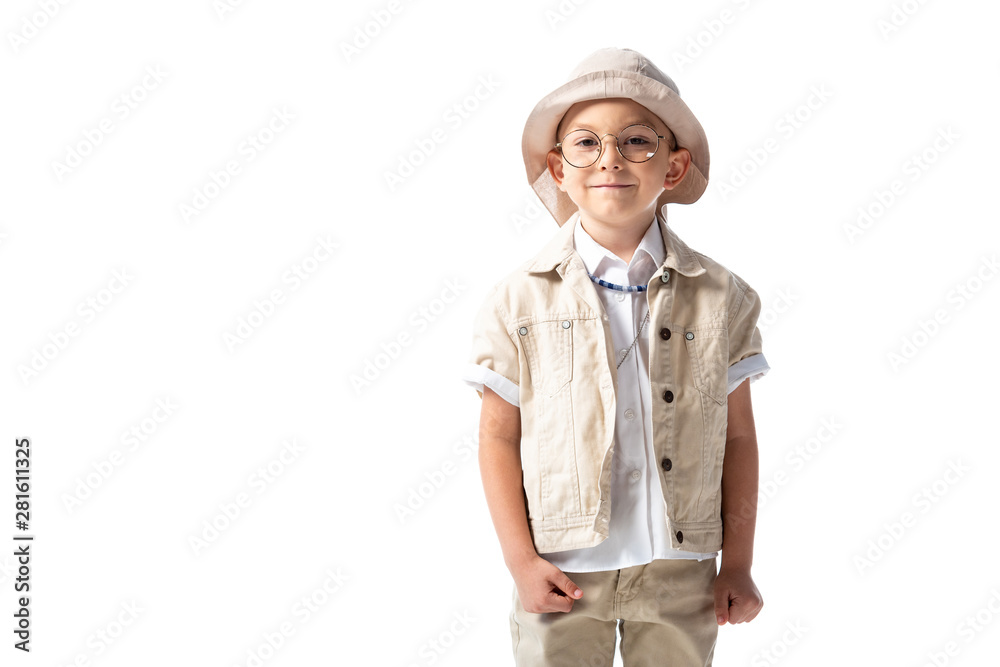 front view of smiling explorer child in hat and glasses looking at camera isolated on white front view of smiling explorer child in hat and glasses looking at camera isolated on white