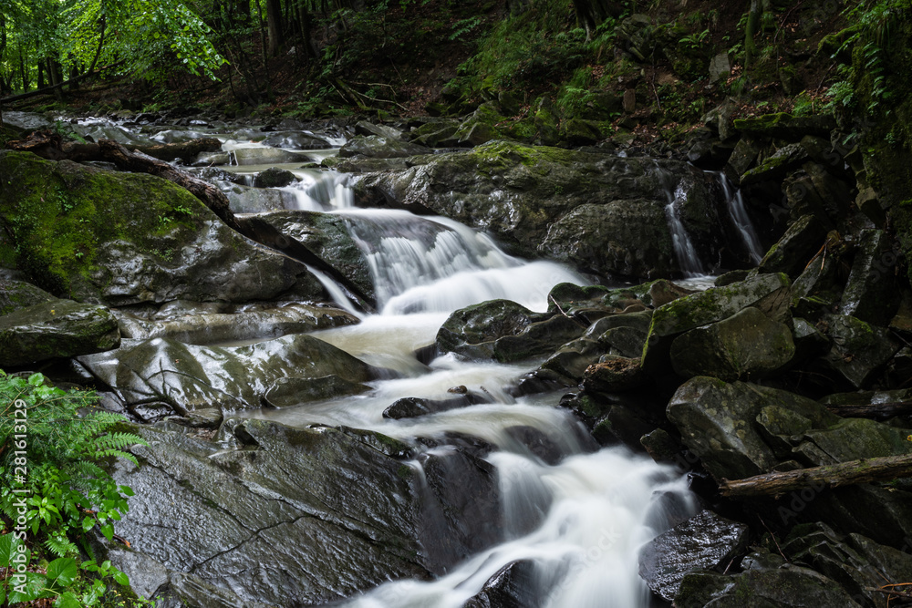 Hulski stream flows through the small Szepit Waterfall in the Bieszczady Mountains. Hulski stream flows through the small Szepit Waterfall in the Bieszczady Mountains.