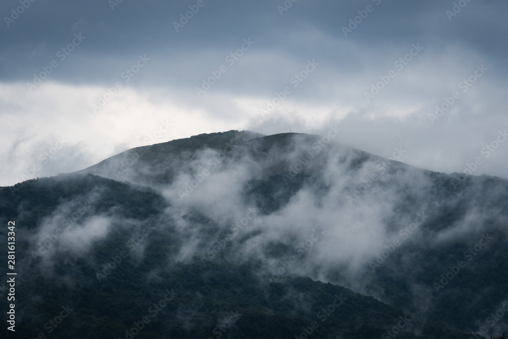 Clouds rise up from the mountaintops in the Bieszczady Mountains.