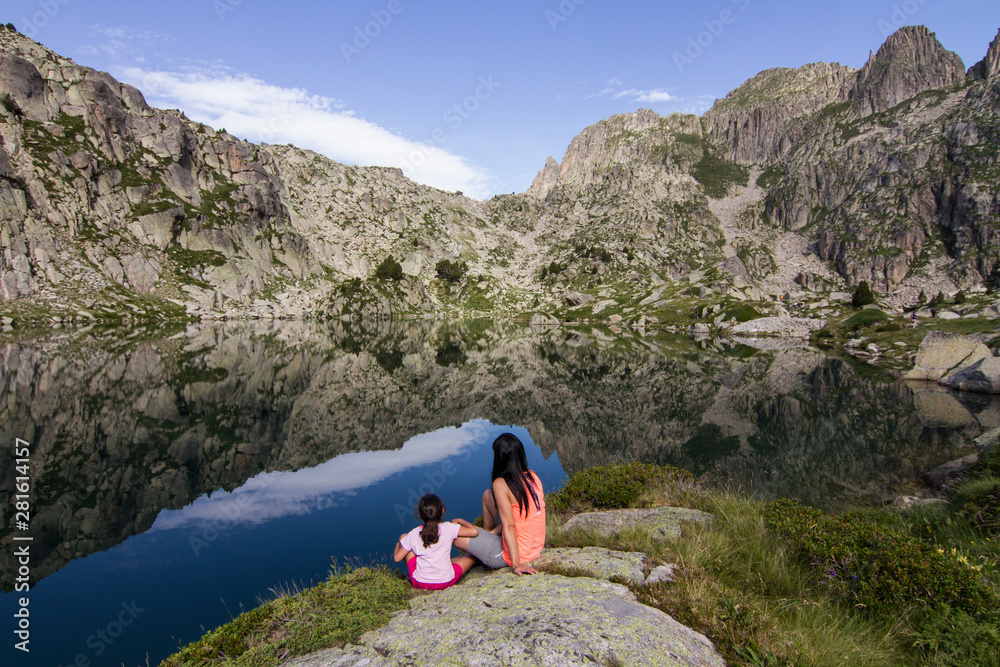 Fototapeta premium Mother and daughter enjoying at the lake