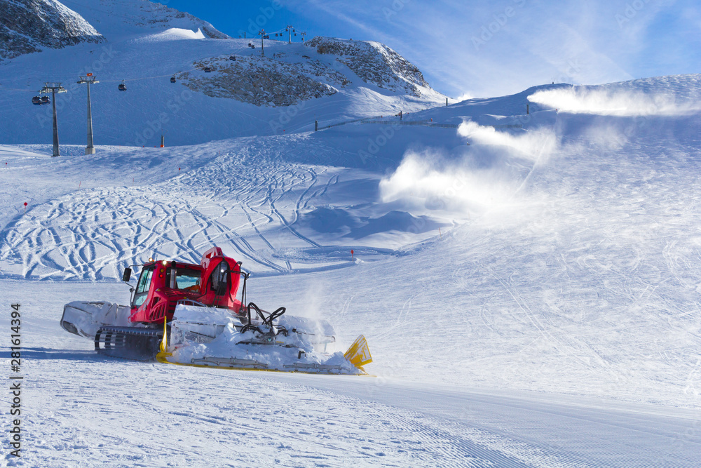 Snowplow clears tracks in the ski resort of the Hintertuxer in Tyrol, Austria
