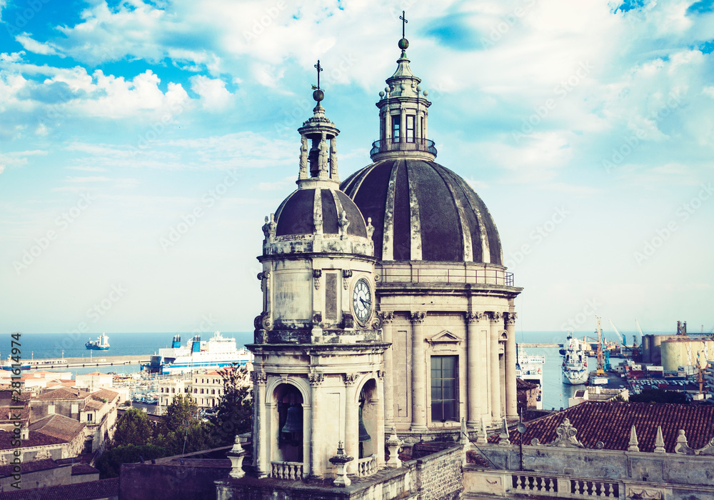 Domes of the Cathedral dedicated to Saint Agatha. The view of the city of Catania, Sicily, Italy .