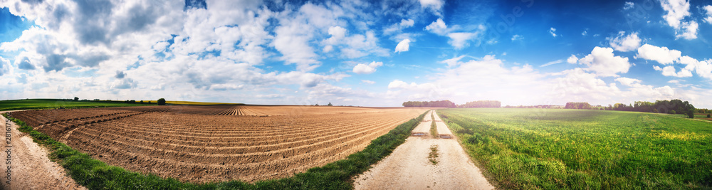 Panoramic agricultural landscape with plowed field