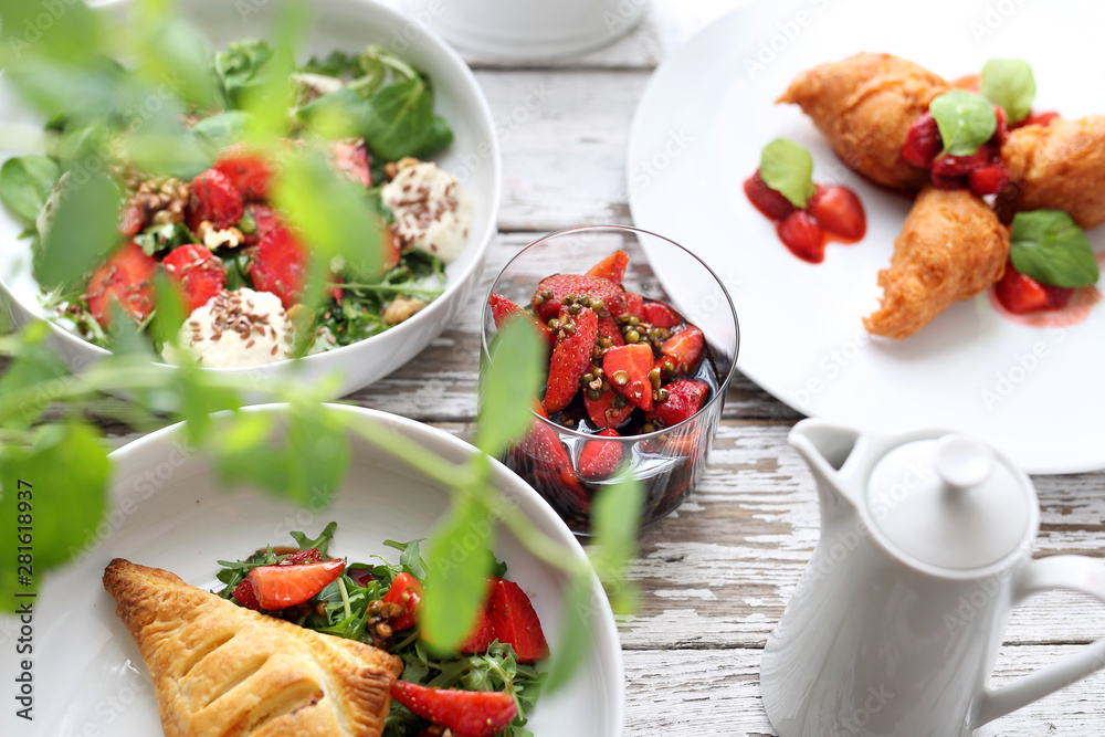 Strawberry dishes. Puff pastry with ricotta, arugula, curd and strawberry salad, strawberries in balsamic vinegar with green pepper, strawberry pancakes Strawberry dishes. Puff pastry with ricotta, arugula, curd and strawberry salad, strawberries in balsamic vinegar with green pepper, strawberry pancakes