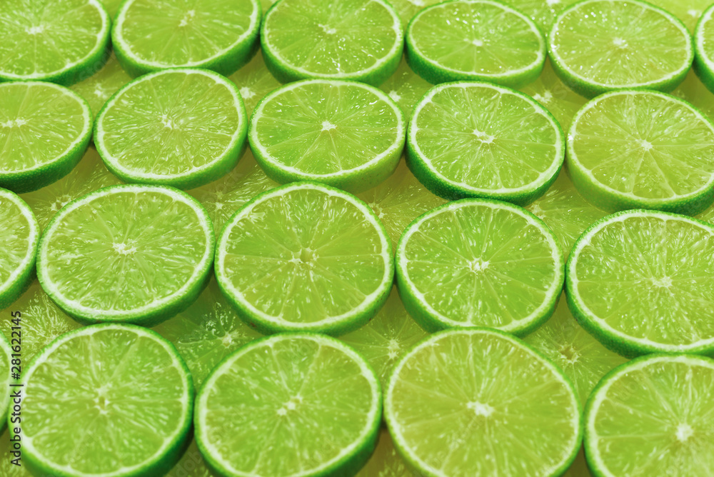 Fresh lime slices as a background. Fresh lime slices as a background.