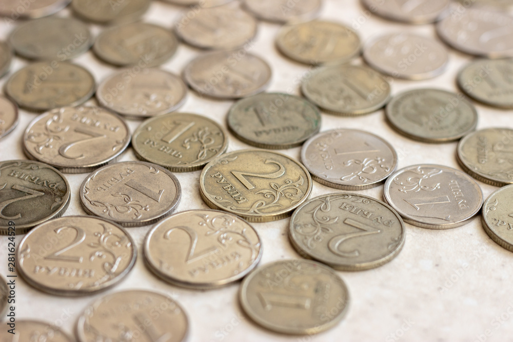 russian coins of white and yellow metal on wooden surface at sunny day. Metallic rubles on a white surface. Russian money on a white surface. Russian metal money. Russian metal rubles russian coins of white and yellow metal on wooden surface at sunny day. Metallic rubles on a white surface. Russian money on a white surface. Russian metal money. Russian metal rubles