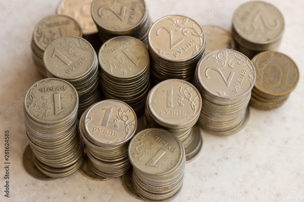 russian coins of white and yellow metal on wooden surface at sunny day. Metallic rubles on a white surface. Russian money on a white surface. Russian metal money. Russian metal rubles russian coins of white and yellow metal on wooden surface at sunny day. Metallic rubles on a white surface. Russian money on a white surface. Russian metal money. Russian metal rubles