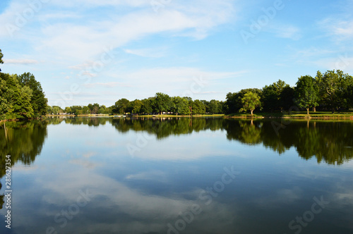 Lake and sky with trees reflecting in water