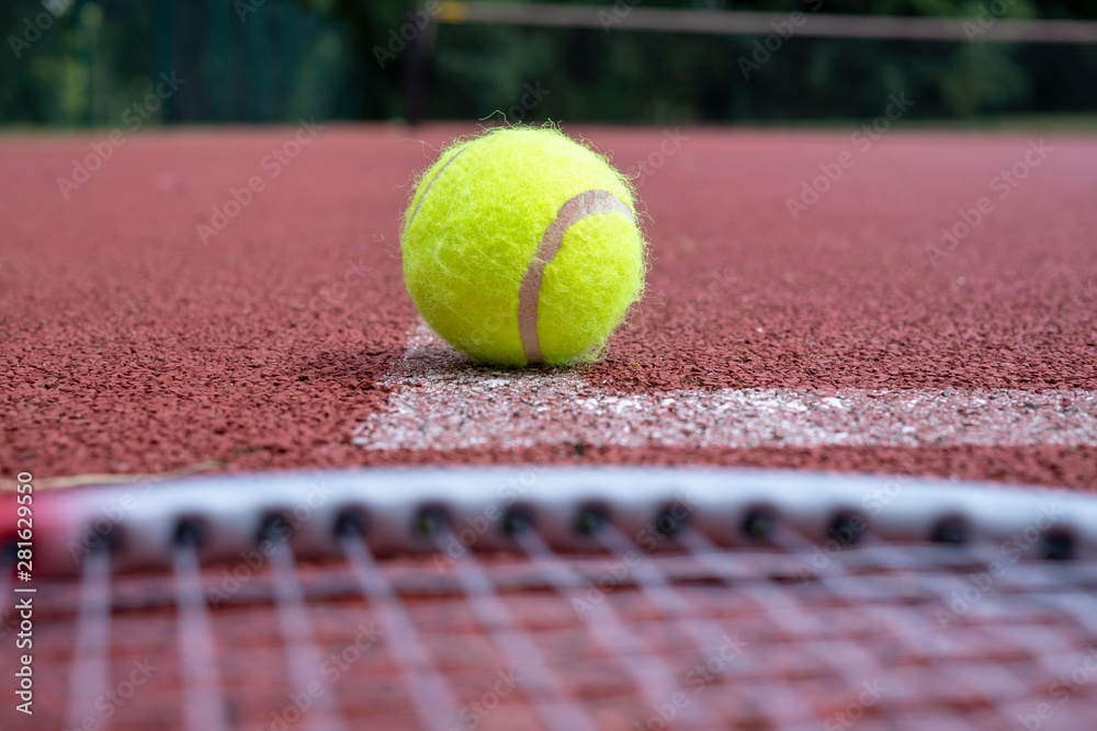 Low angle view tennis scene with ball and racquet
