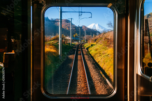 Autumn scenery along train tracks seen from driver room window