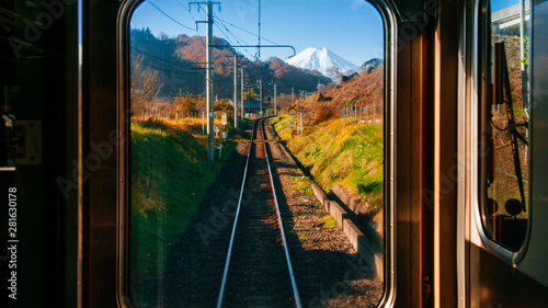 Autumn scenery along train tracks seen from driver room window